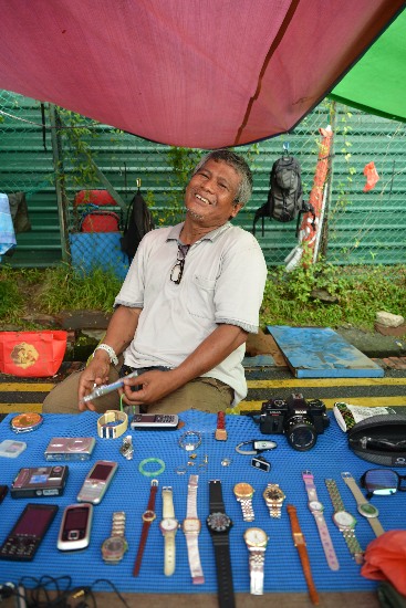 Sunny is at the market every day, selling his old stuff.